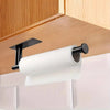 Stainless steel under cabinet paper towel holder with a white roll of paper towels mounted on a wooden cabinet