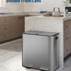A stainless steel double trash can with a recycling bin sitting on a kitchen countertop.