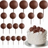A collection of 20 brown spherical cake toppers on sticks arranged around a decorated cake.
