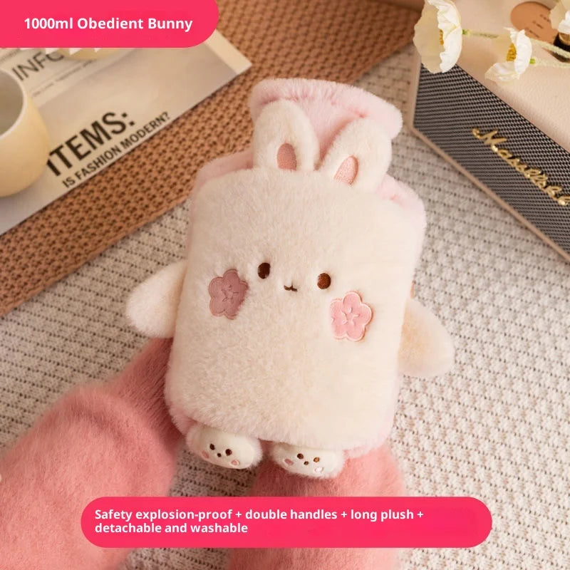 A pink fluffy bunny plush toy is held in a hand, demonstrating its features.