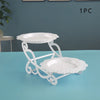 White decorative plastic dessert stand with two saucers for fruit and candy