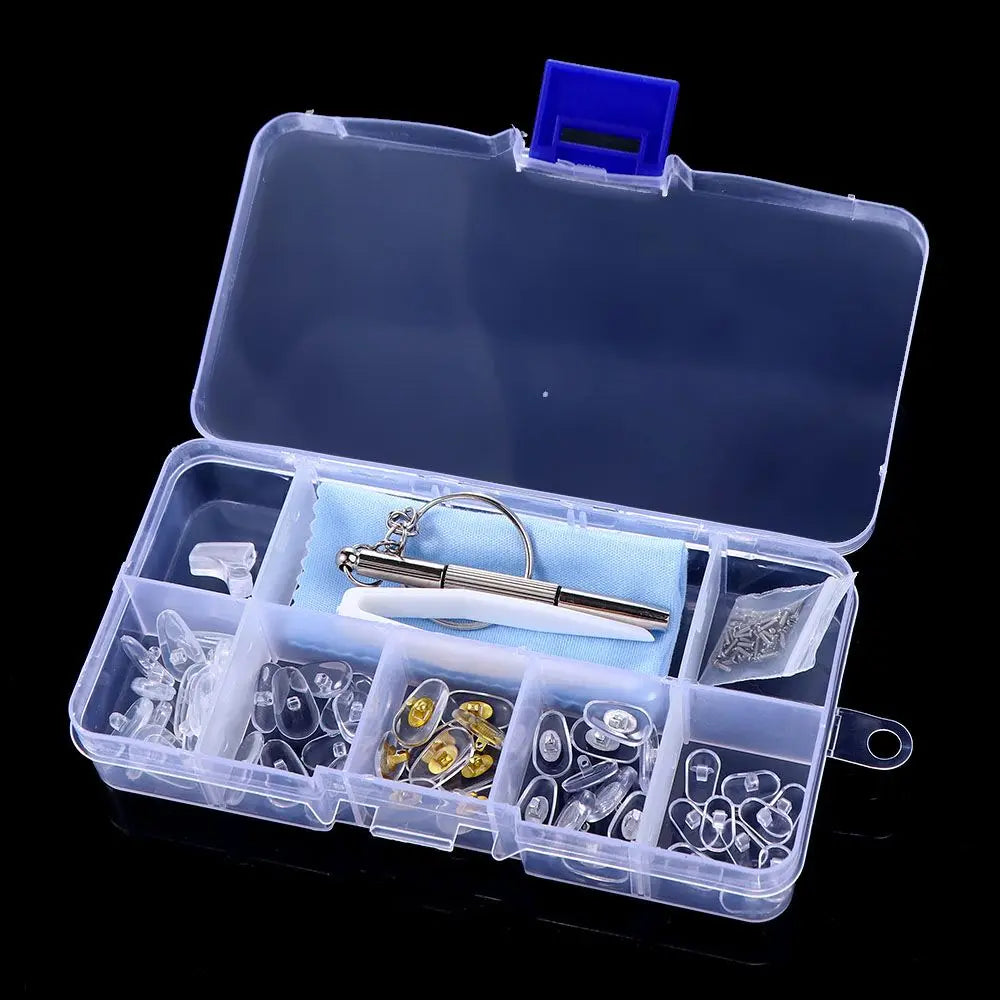 A clear plastic kit containing various tools and components for precision glasses repair, including a screwdriver and small p