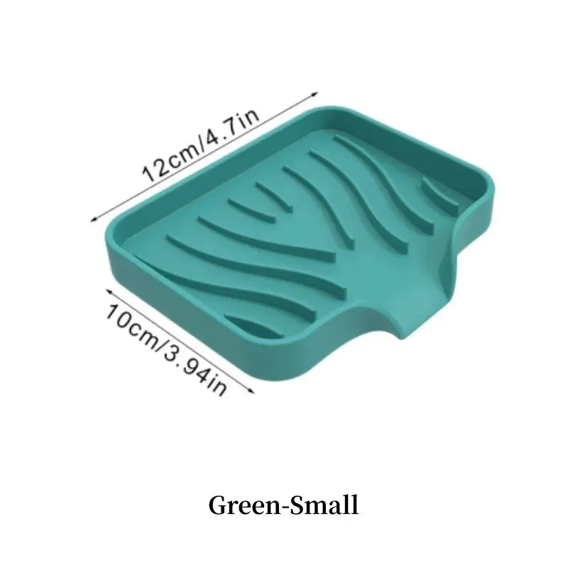 A teal silicone draining soap tray organizer with wavy grooves, measuring 12cm long and 10cm wide.