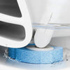 A reusable toilet cleaning brush set is shown submerged in water, with a white cleaning head and a blue cleaning pad.