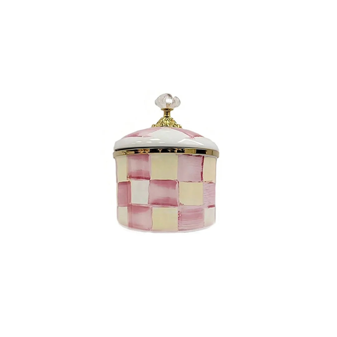 Retro enamel storage jar with a lid featuring a pink and cream checkered pattern.