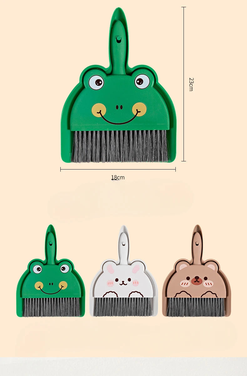 A set of three cartoon animal brooms and dustpans in green, pink, and brown tones.