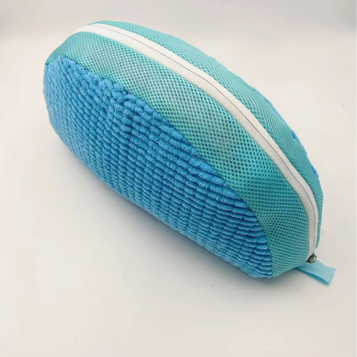 A teal fabric storage bag for a shoe cleaning set with white piping.