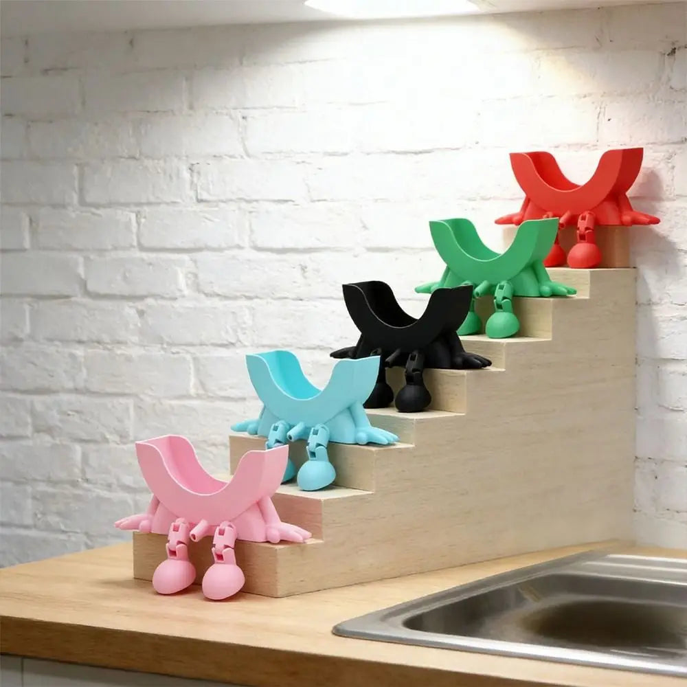 A wooden staircase display featuring colorful, cute sponge holders in pink, blue, green, and red.