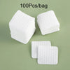 A pile of white cotton pads for nail and gel polish removal, packaged in a bag.