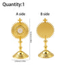 A side and B side views of a gold metal religious ornament featuring a sunburst design and a cross.