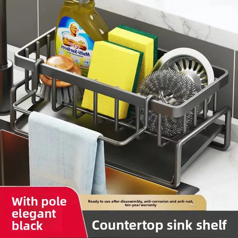 Black countertop sink shelf holding various kitchen tools including sponges and scrub brushes
