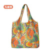 Eine farbenfrohe, florale Muster- wiederverwendbare Stofftasche.