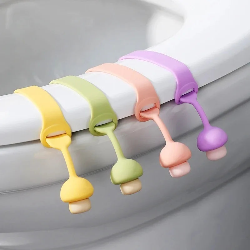 A set of colorful silicone toilet seat lifter rings in pastel shades, arranged horizontally.