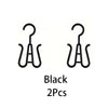 A set of two black portable plastic wig hangers.