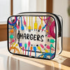 A clear plastic travel organizer pouch filled with various electronic chargers and cables.