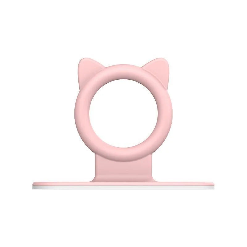 A pink silicone self-adhesive cabinet door handle lifter with a cat-ear design.