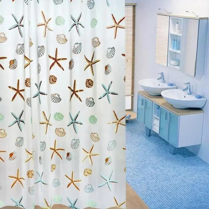 A white shower curtain featuring starfish and seashell patterns in gold, teal, and brown tones.