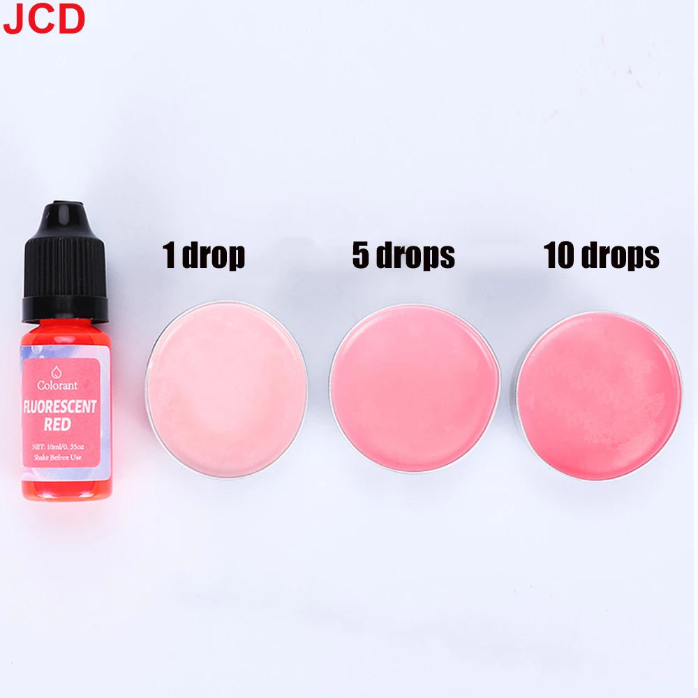 A set of cosmetic drops showing 1, 5, and 10 drops of fluorescent red liquid candle dye.