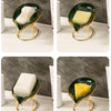 A set of decorative leaf soap dishes featuring white and yellow bars on gold-toned metal stands.