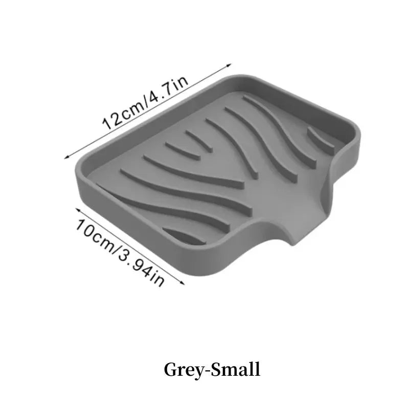 A grey silicone draining soap tray organizer with wavy grooves, measuring 12cm by 10cm.