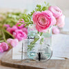 A heart-shaped acrylic keepsake plaque with engraved text for Father's Day resting on a wooden surface.