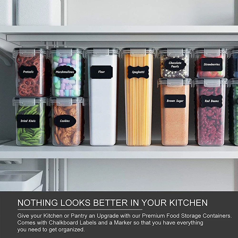 A row of clear food storage containers filled with various dry goods like pretzels, marshmallows, flour, spaghetti, brown sug