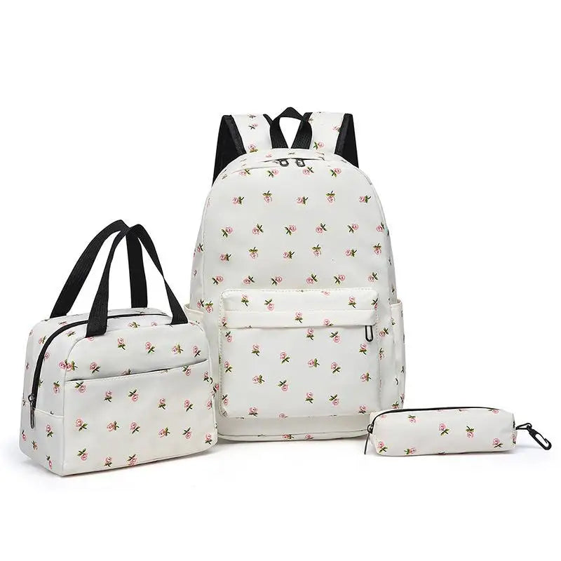 A white floral print backpack set including a matching handbag and pencil case.