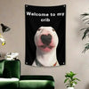 A black tapestry featuring a humorous illustration of a dog's face with a heart shape on its nose.