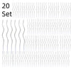 Ein Set dekorativer Spiral-Geburtstagskerzen in Silber und Weiß.