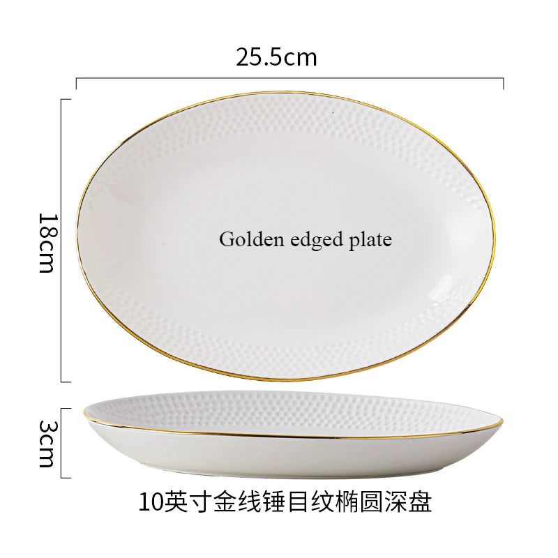 A set of white ceramic soup bowls with a golden edge and a rectangular plate.