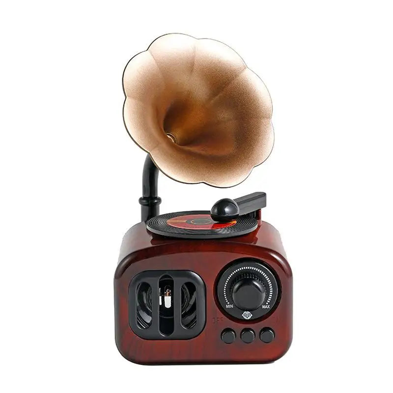 A vintage wooden phonograph music box with a brass horn and turntable is shown against a white background.