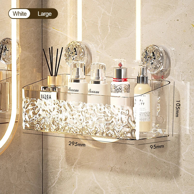 A clear glass storage rack with stainless steel suction cups holds various cosmetic bottles and brushes on a marble surface.