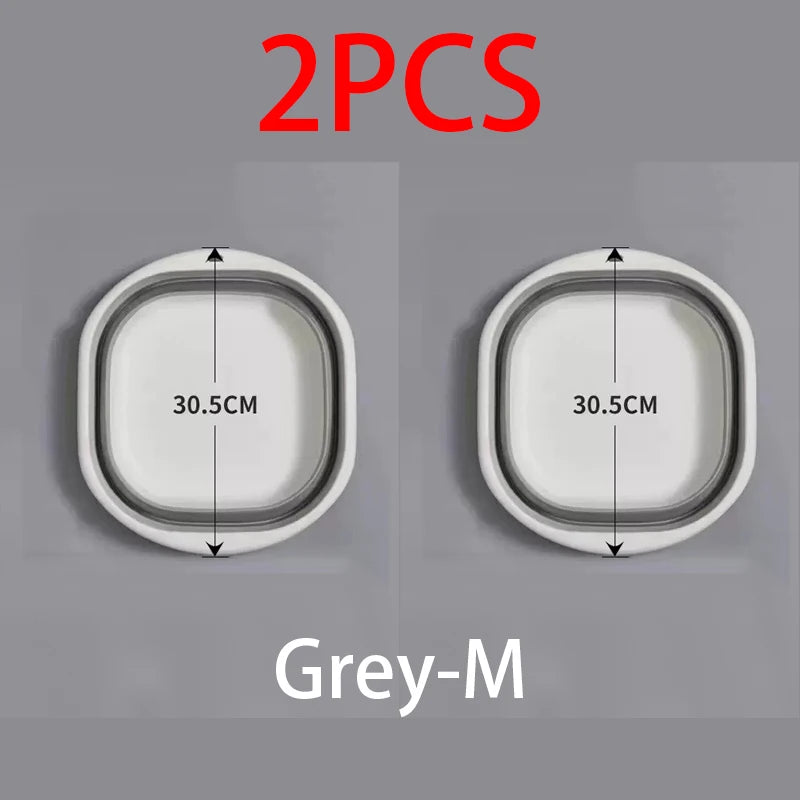 Two grey-m colored foldable plastic wash basins shown side by side