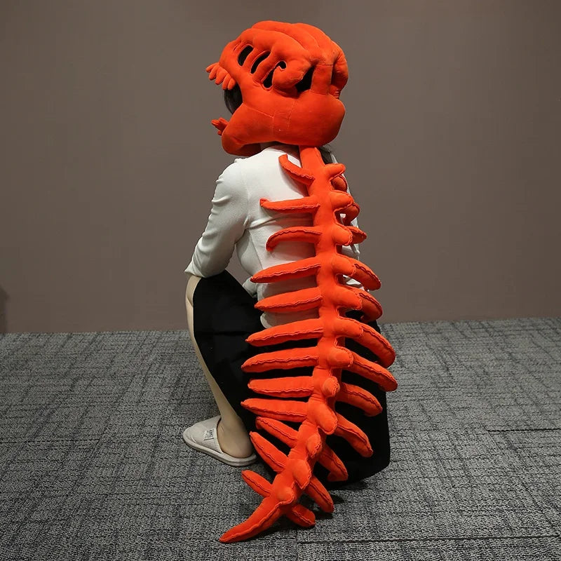 A realistic dinosaur skeleton costume featuring an orange, textured rib cage and spine on a white shirt.