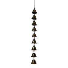 A vertical arrangement of small vintage metal wind chimes hanging from a chain.