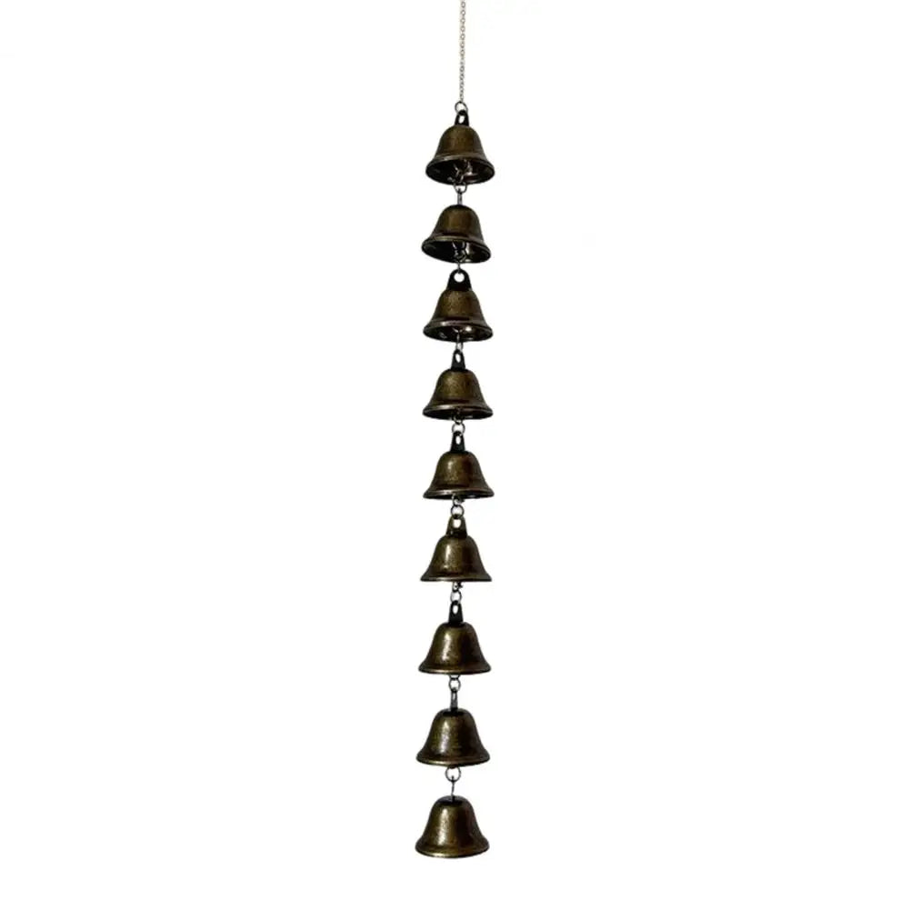 A vertical arrangement of small vintage metal wind chimes hanging from a chain.