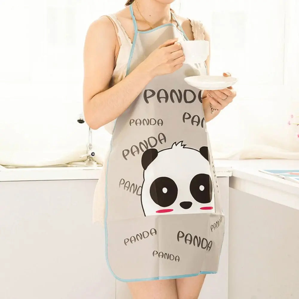 A woman wearing a light gray oil-proof cooking apron with panda graphics, holding a white cup.