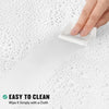 A hand wipes a white shower curtain liner on a wet surface with a white cloth, demonstrating easy cleaning.