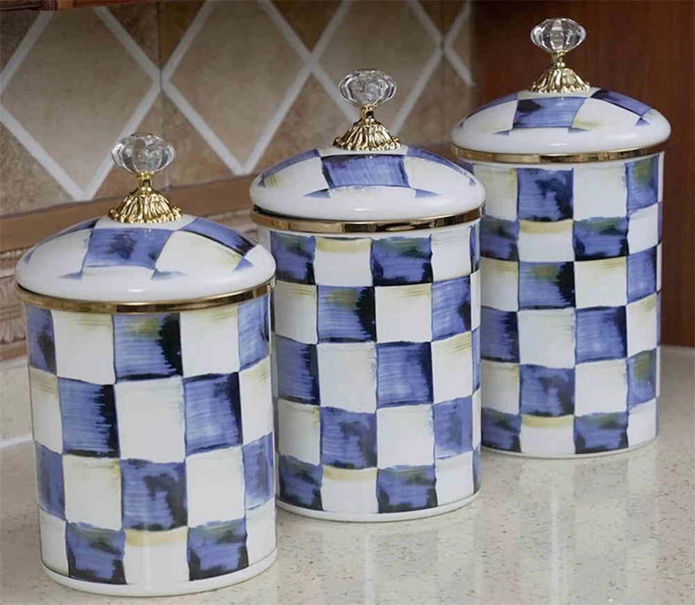 A set of retro enamel storage jars with airtight lids featuring a blue and white checkered pattern.