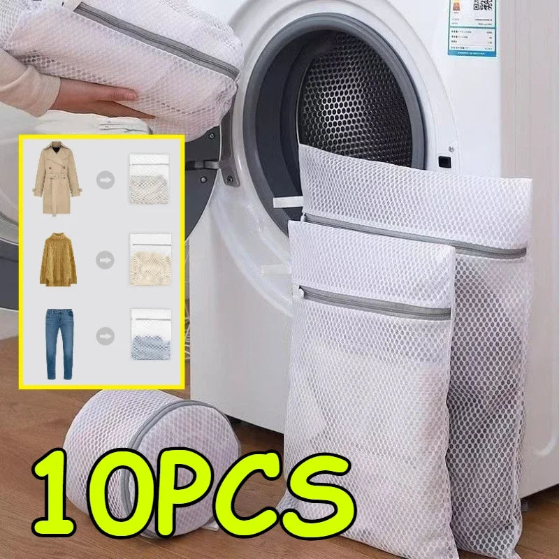 Ten reusable honeycomb mesh laundry bags and a clothing hanger are shown next to a white washing machine.