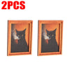 Zwei gerahmte Drucke einer schwarzen Katzen-Silhouette vor orangefarbiger Hintergrund für Home Decor
