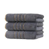 A stack of gray coral fleece towels with gold stripe detailing.