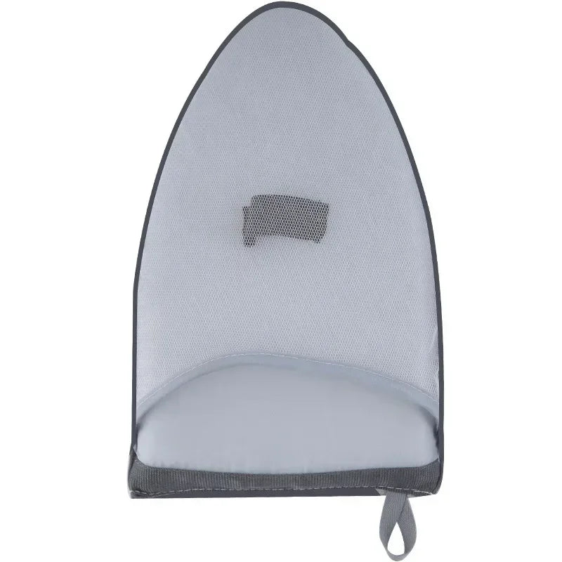 A gray portable hand-held ironing board and garment steamer with a mesh cover.
