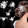 A set of white pearl flower bridal hair clips arranged in various styles for updos and hairstyles.