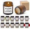 A collection of small glass jars containing various scents labeled Yuor Logo including Jasmine, Wild Bluebell, Lavender, and 