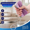 A hand is using a purple and rainbow reusable sponge cleaning cloth to wipe water from a glass.