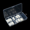 A clear plastic organizer box containing multiple white nail tips and related tools.