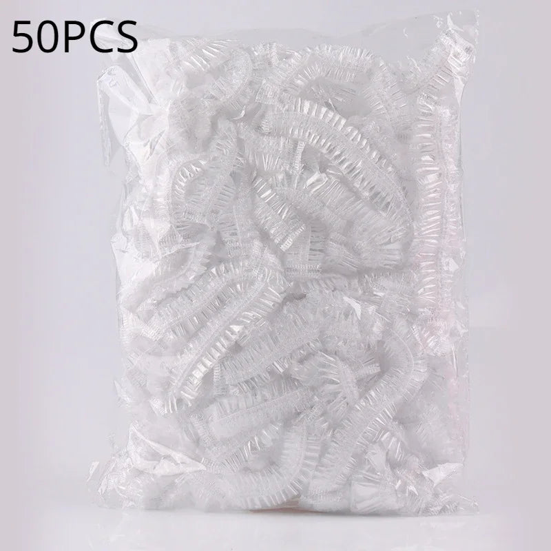 A clear plastic bag containing 50 pieces of reusable transparent shower caps.