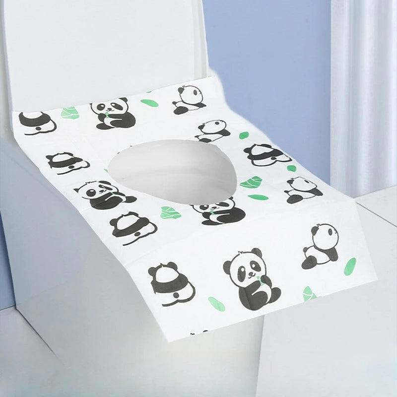 A white disposable printing seat cover featuring a pattern of black panda silhouettes on a light blue background.