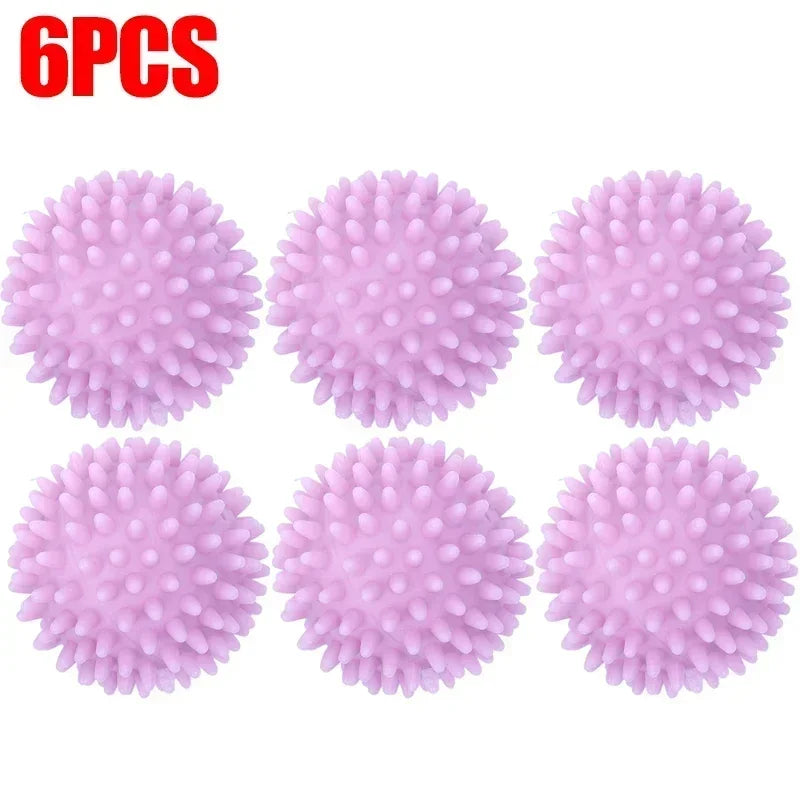Six pink reusable silicone laundry balls arranged in a row.